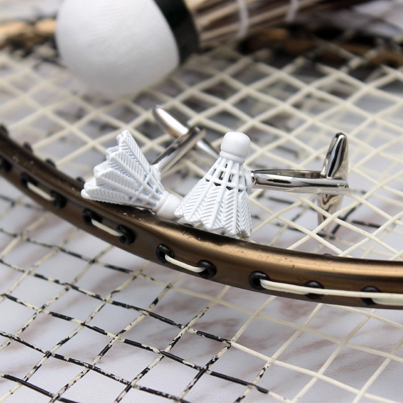 A pair of elegant Shuttlecock Cufflinks made from titanium alloy, featuring a polished finish and unique shuttlecock design, presented in a stylish gift box.