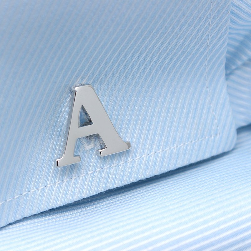 A pair of elegant silver alphabets cufflinks featuring capitalized letters, crafted from brass and chrome plated, presented in a stylish gift box.