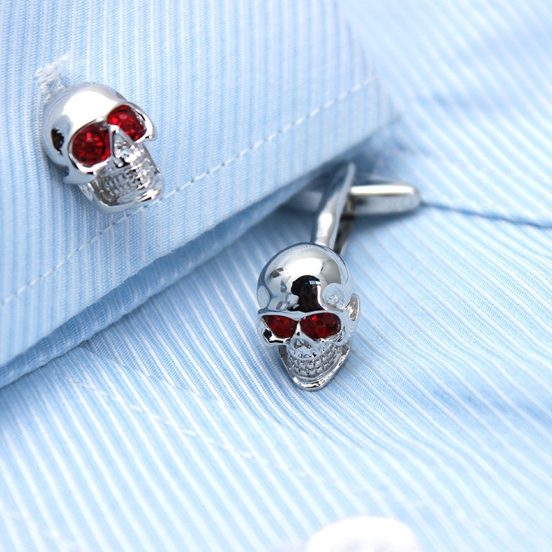 Stylish skull cufflinks made of stainless steel with rhodium plating, presented in a hard-sided gift box.