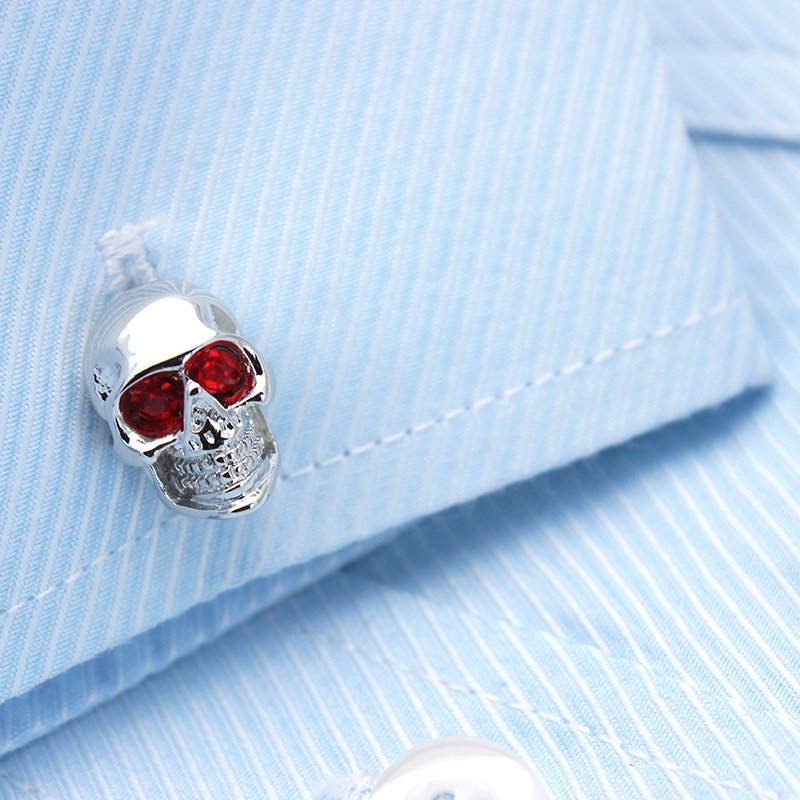 Stylish skull cufflinks made of stainless steel with rhodium plating, presented in a hard-sided gift box.