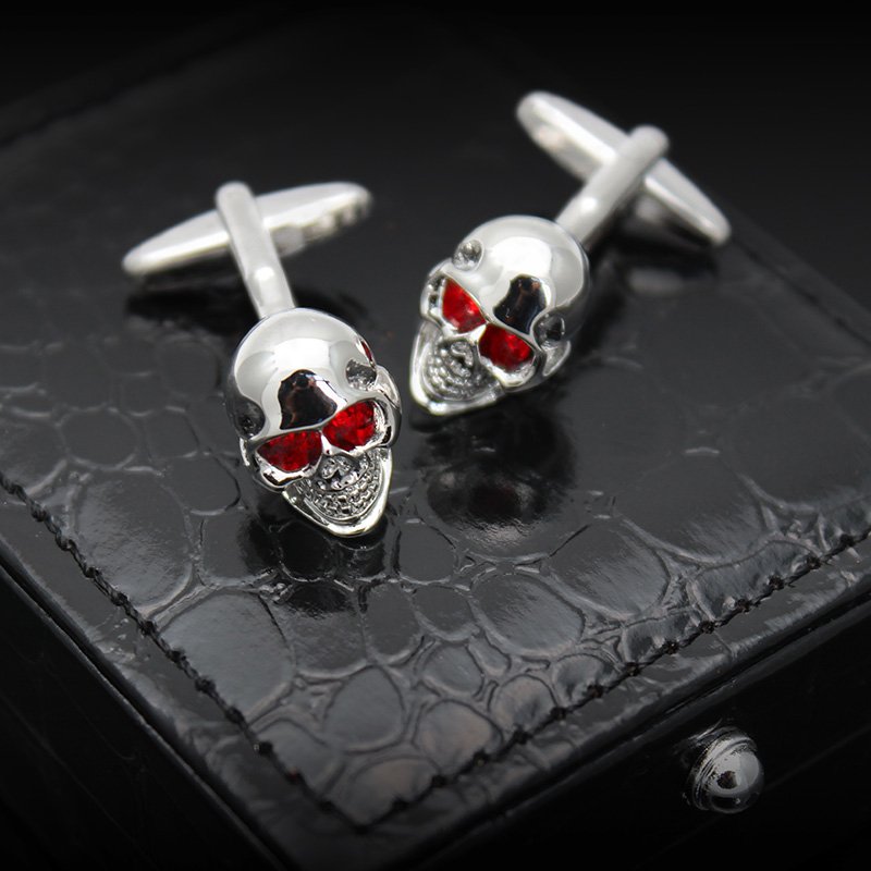 Stylish skull cufflinks made of stainless steel with rhodium plating, presented in a hard-sided gift box.