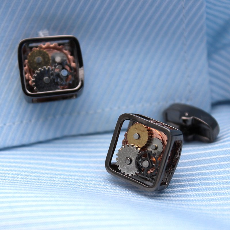 A pair of stylish Steampunk Gears Cufflinks made from stainless steel with intricate gear designs, presented in a hard-sided gift box.