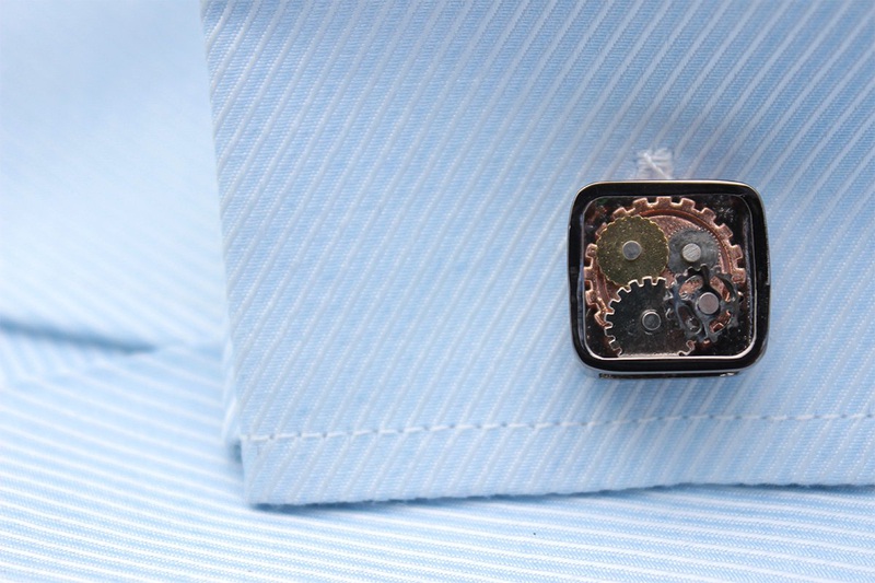 A pair of stylish Steampunk Gears Cufflinks made from stainless steel with intricate gear designs, presented in a hard-sided gift box.