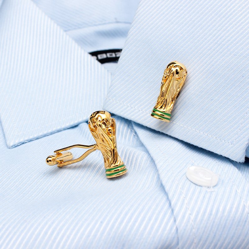 A pair of luxurious World Cup Cufflinks made from titanium alloy, featuring a unique design and elegant finish, displayed in a hard-sided presentation box.