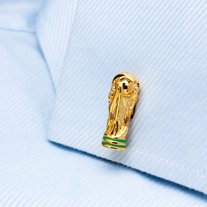 A pair of luxurious World Cup Cufflinks made from titanium alloy, featuring a unique design and elegant finish, displayed in a hard-sided presentation box.