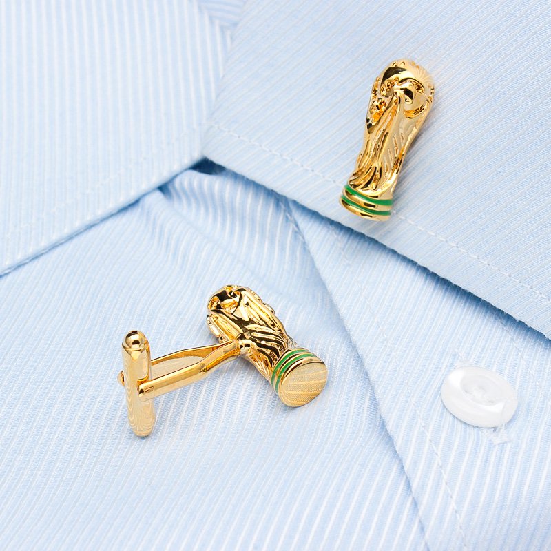 A pair of luxurious World Cup Cufflinks made from titanium alloy, featuring a unique design and elegant finish, displayed in a hard-sided presentation box.