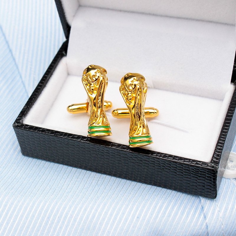 A pair of luxurious World Cup Cufflinks made from titanium alloy, featuring a unique design and elegant finish, displayed in a hard-sided presentation box.