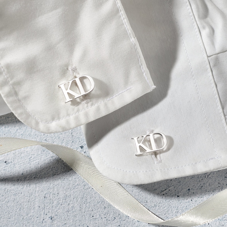 Elegant personalized wedding cufflinks made of 925 Sterling Silver, featuring custom initials, available in silver and gold finishes.