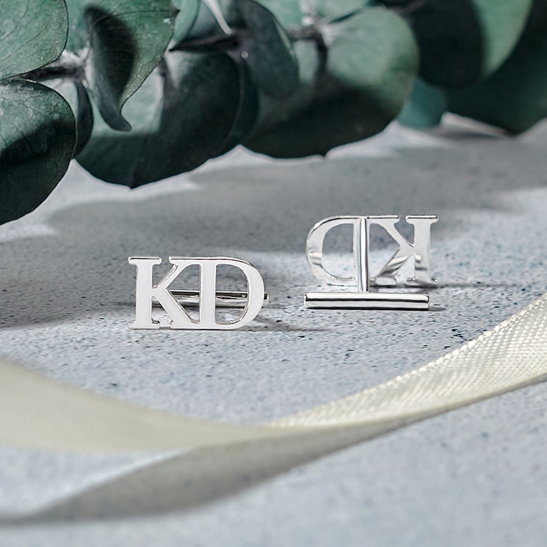 Elegant personalized wedding cufflinks made of 925 Sterling Silver, featuring custom initials, available in silver and gold finishes.