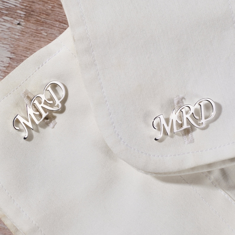 Elegant personalized wedding cufflinks made of 925 Sterling Silver, featuring custom initials, available in silver and gold finishes.