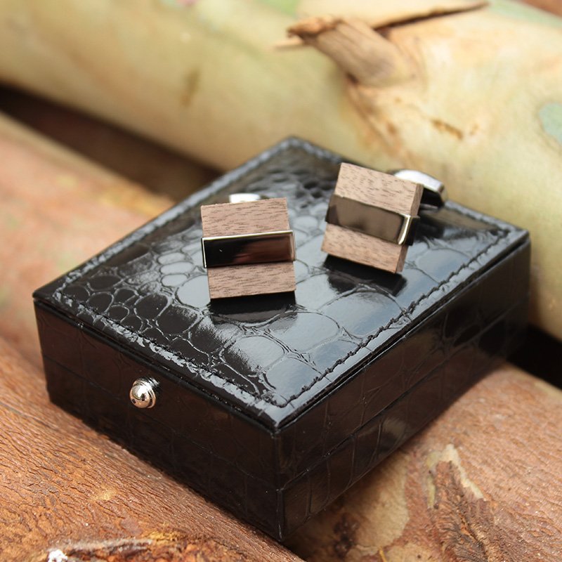 A pair of elegant Wenge Wood Cufflinks made from titanium alloy and wood, displayed in a hard-sided presentation box.