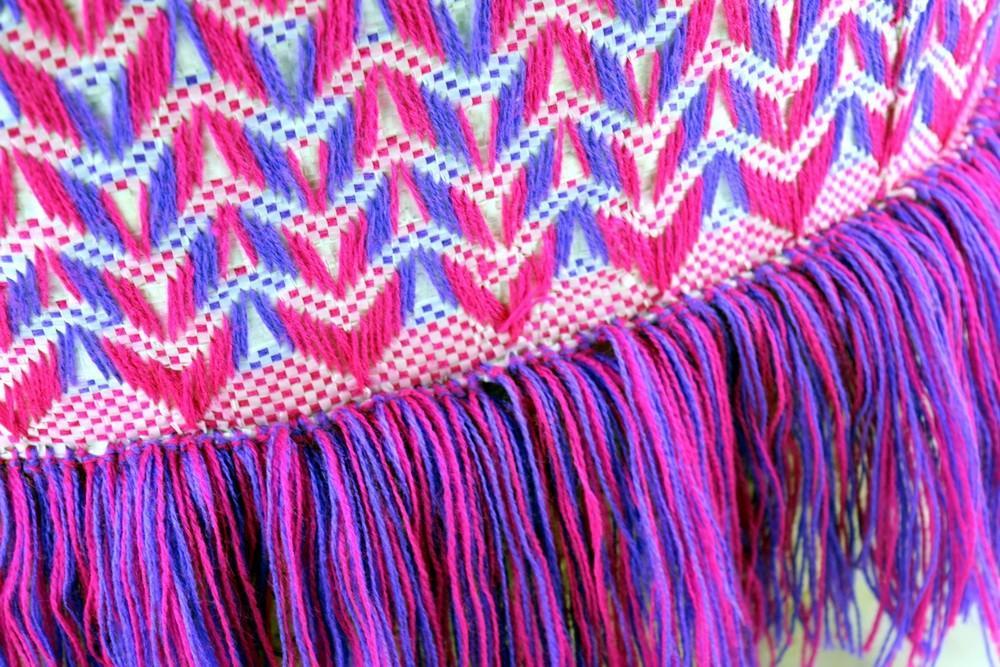 Artisan Purple Fuchsia Fringe Tote featuring vibrant color and stylish fringe details, perfect for casual outings.