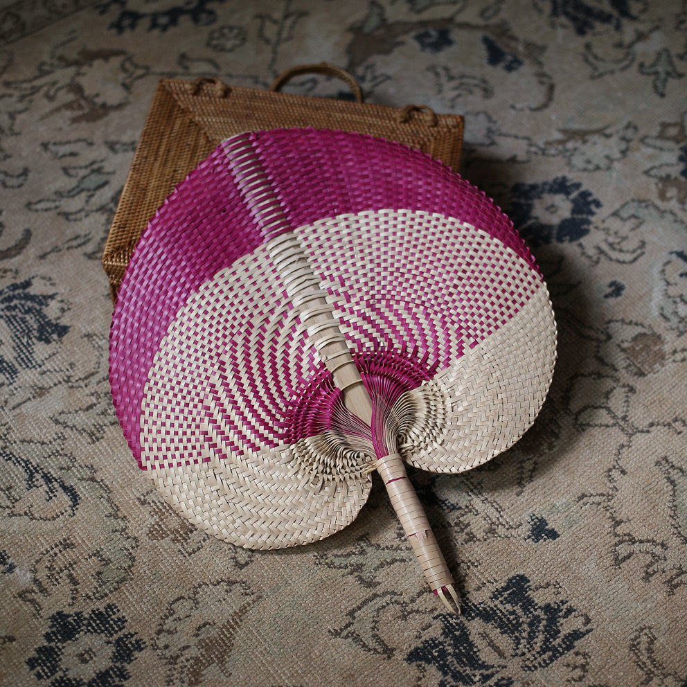 Balinese Woven Hand Fan 'Aphrodite' made from Lontar Palm straws, showcasing intricate weaving patterns and natural colors.