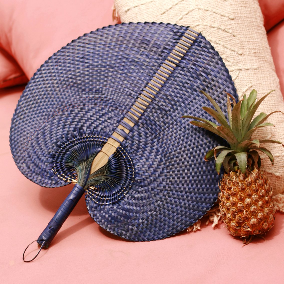 Balinese Woven Hand Fan 'Azure' made from Pandan straws, showcasing intricate patterns and vibrant colors, perfect for summer and tropical decor.