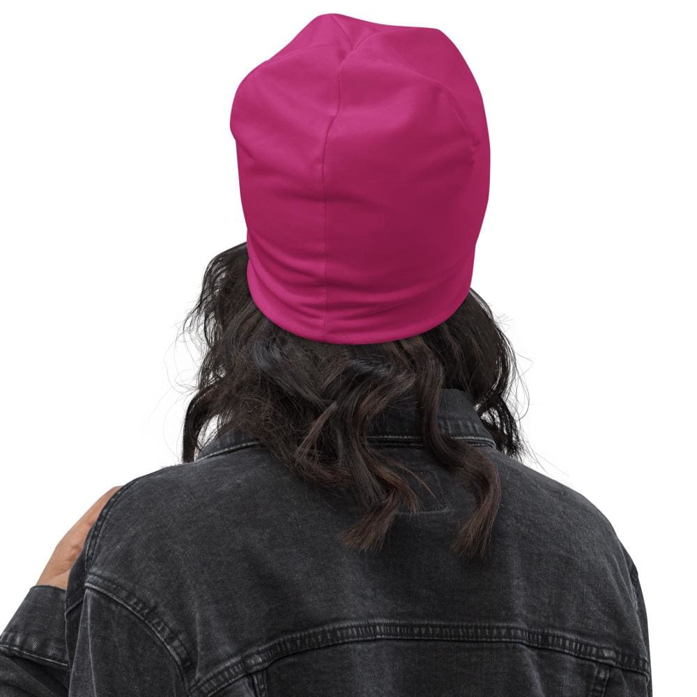 A stylish pink slouchy beanie featuring a Prayer Warrior print, designed for both men and women, showcasing its trendy and comfortable design.