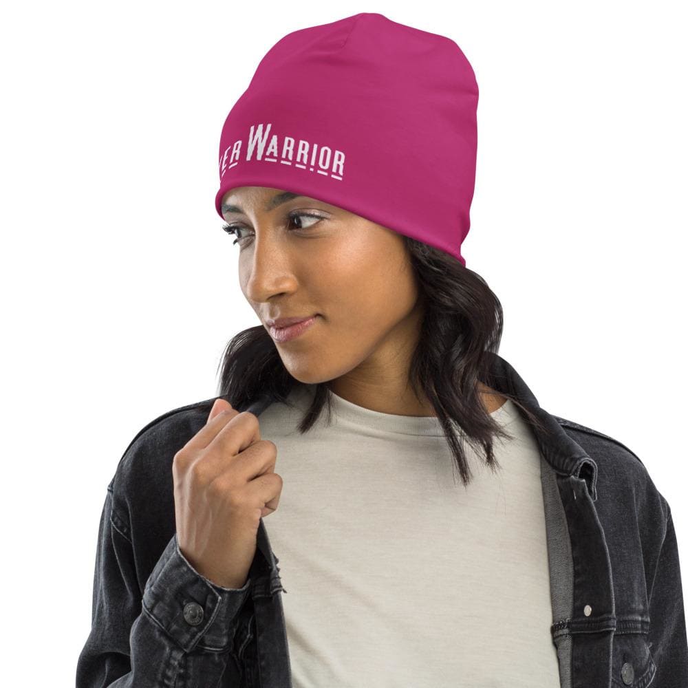 A stylish pink slouchy beanie featuring a Prayer Warrior print, designed for both men and women, showcasing its trendy and comfortable design.