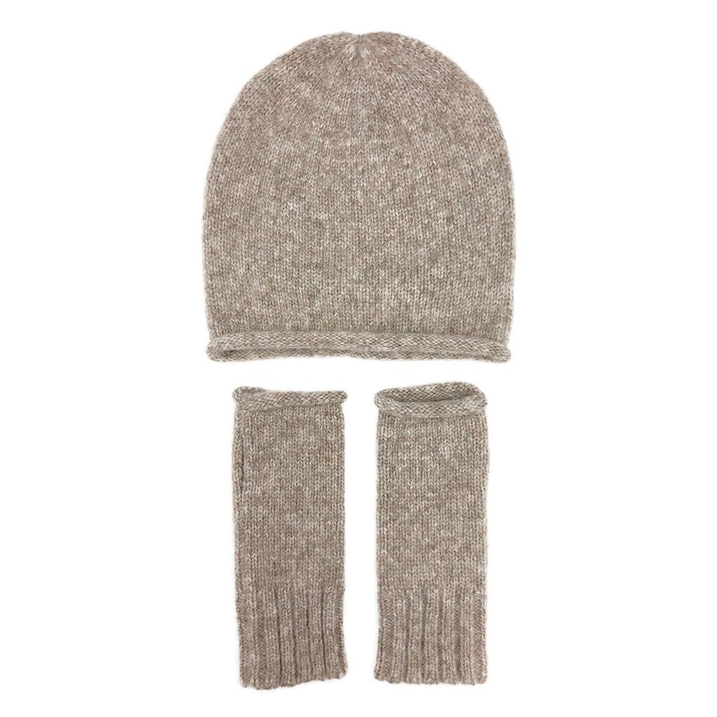 Beige Essential Knit Alpaca Beanie, handmade in Peru, showcasing its soft texture and slouchy design, perfect for winter fashion.