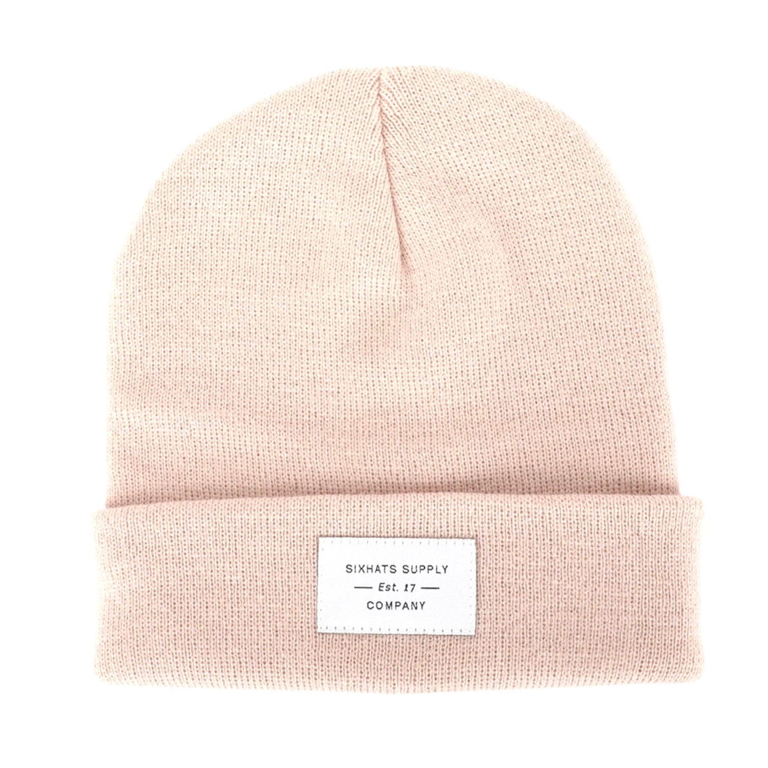 A soft beige folding beanie displayed on a neutral background, showcasing its stylish design and woven label.