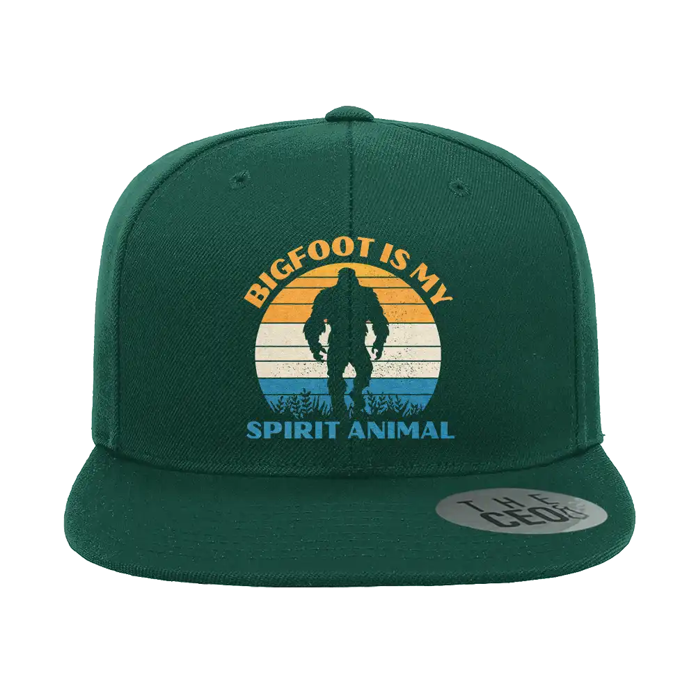 Bigfoot Is My Spirit Animal Embroidered Flat Bill Cap featuring a structured design and green under visor.