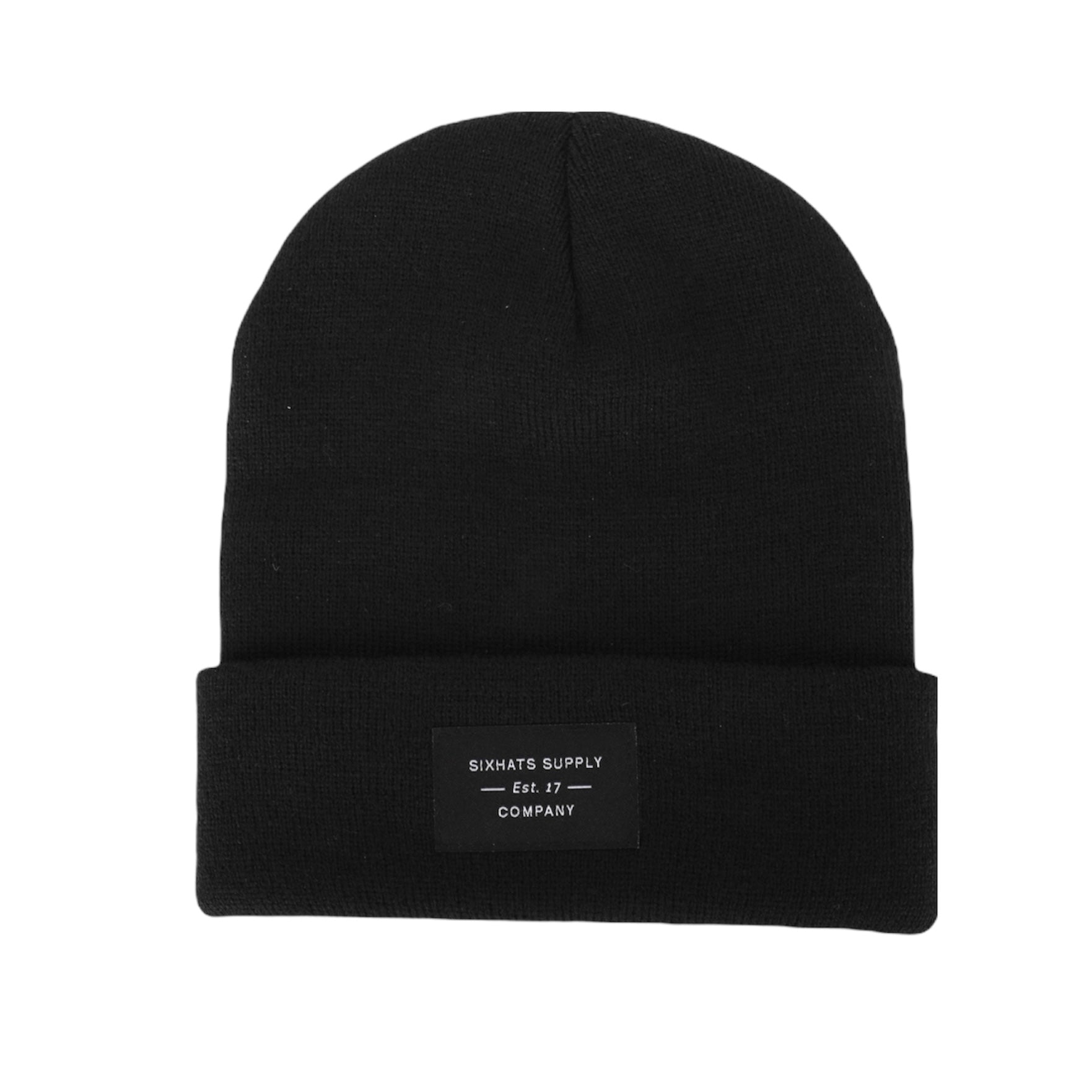 A soft black folding beanie with a woven label, showcasing its stylish design and versatility for various outfits.