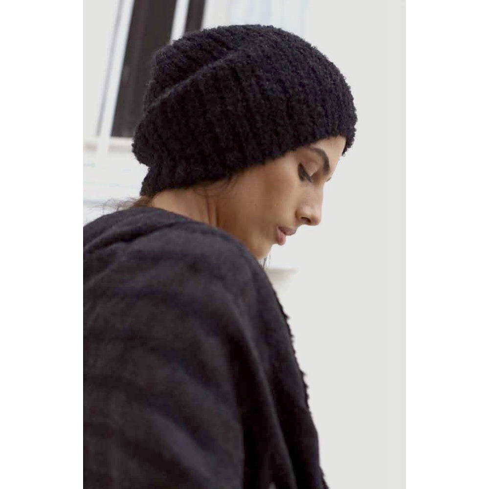 Black Loop Knit Alpaca Beanie showcasing a soft ribbed texture, perfect for winter wear, handmade in Peru.