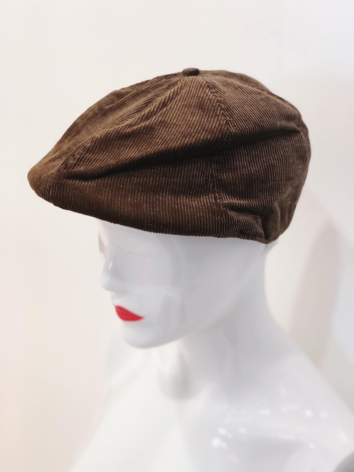 A stylish 'Blaze' Brown Soft Beret made from soft fabric, showcasing its elegant design and versatile color.