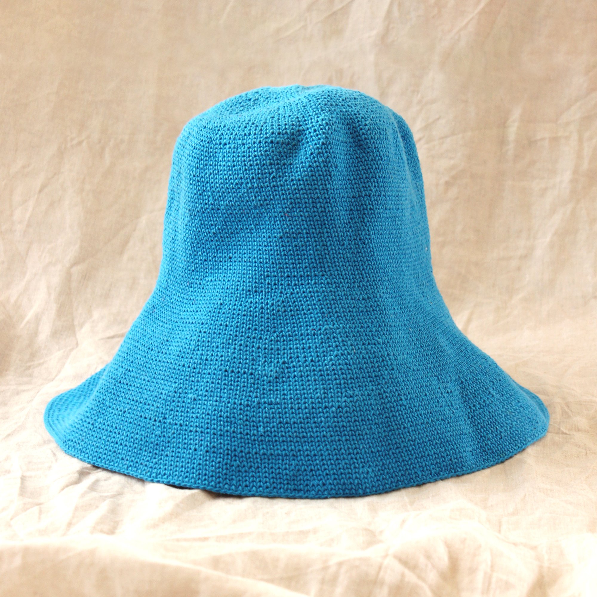 BLOOM Crochet Hat in Mosaic Blue, featuring a soft crochet design inspired by Calla Lily shape, perfect for outdoor activities.