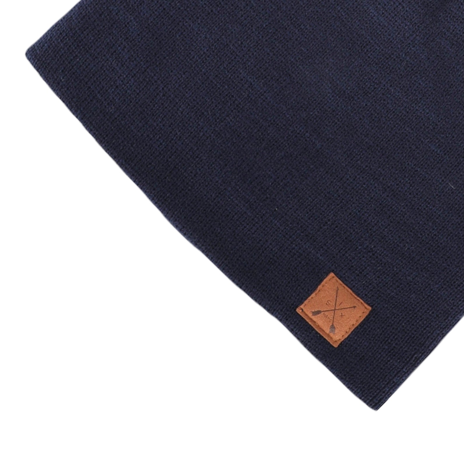 A stylish blue beanie with a suede arrow patch, perfect for winter sports and outdoor activities.