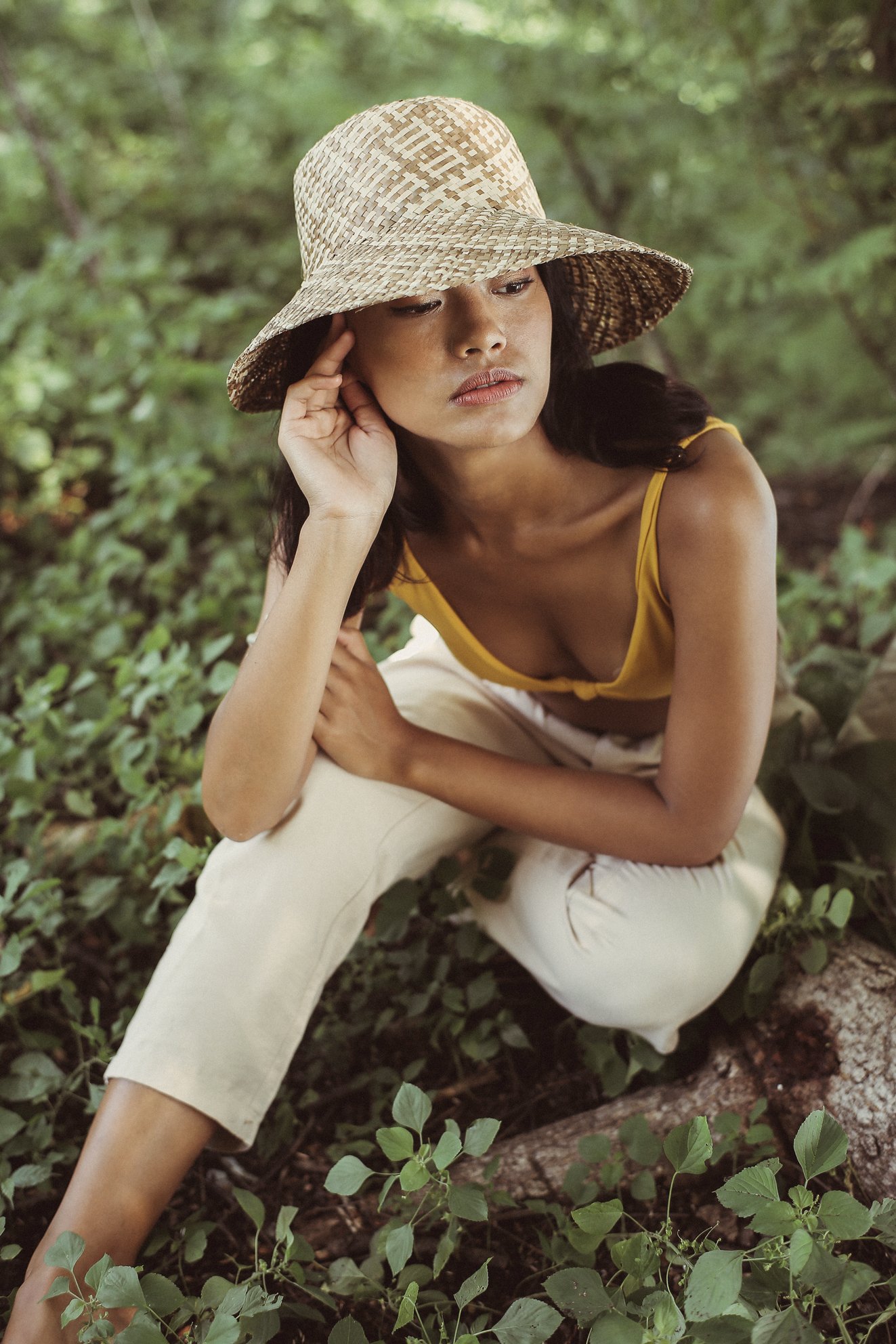 A handmade beige Borneo Fisherman Bucket Straw Hat made from Lontar straw, showcasing its wide brim and flexible structure, perfect for sun protection.