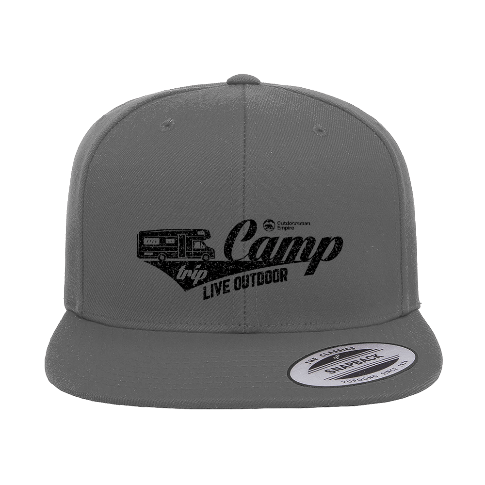 Camp Trip Embroidered Flat Bill Cap featuring a structured design, green under visor, and adjustable snapback closure.