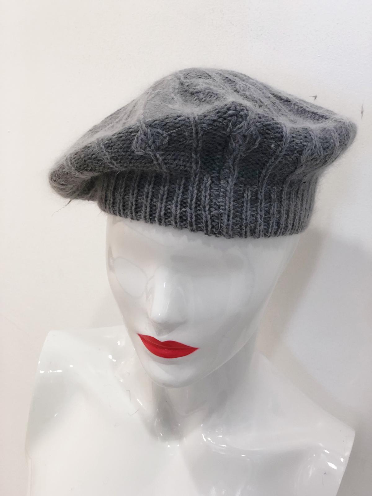 A stylish 'Cassidy' Grey Beret made from soft fabric, perfect for enhancing any outfit.