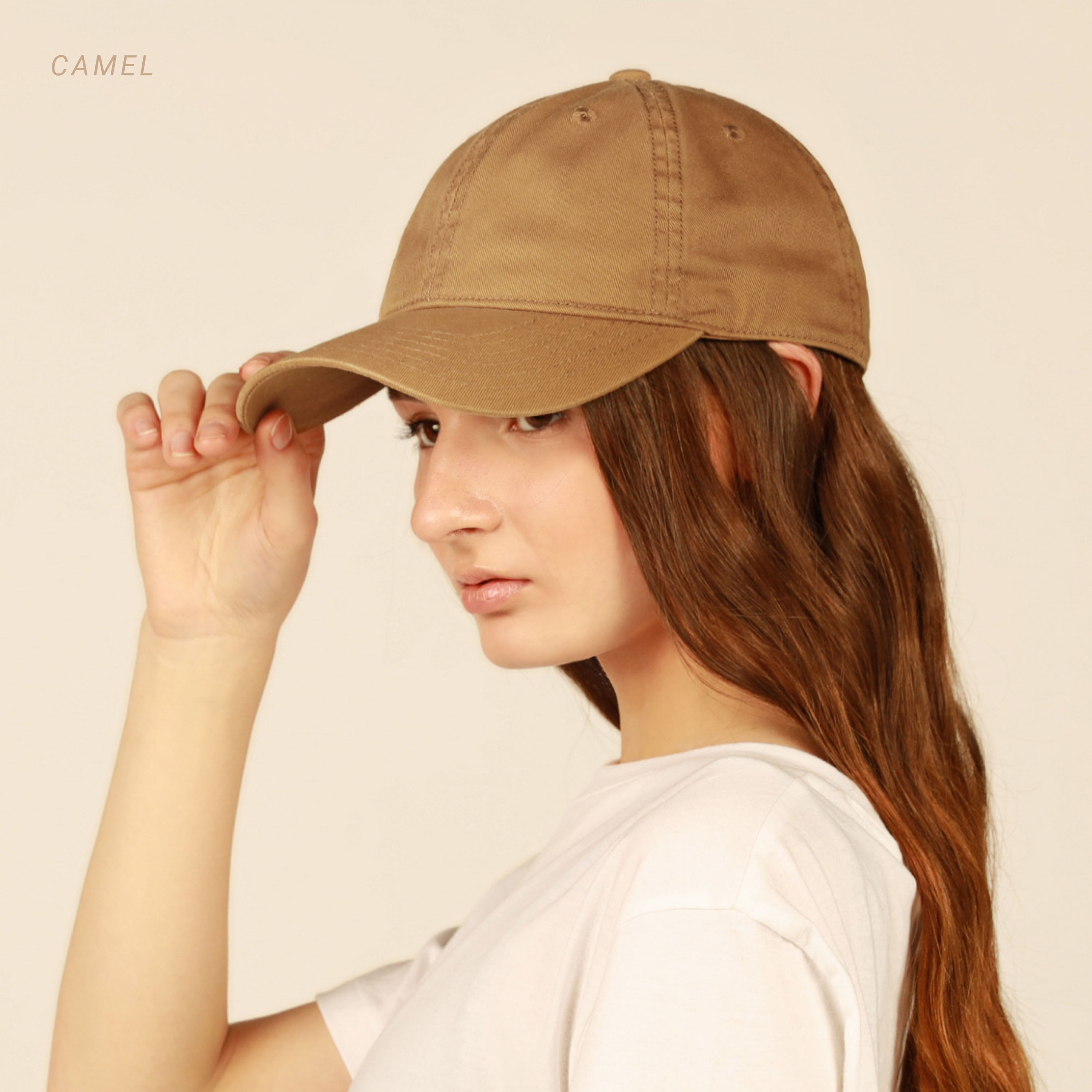 Classic Everyday Baseball Cap in various colors with a curved bill and adjustable back buckle.