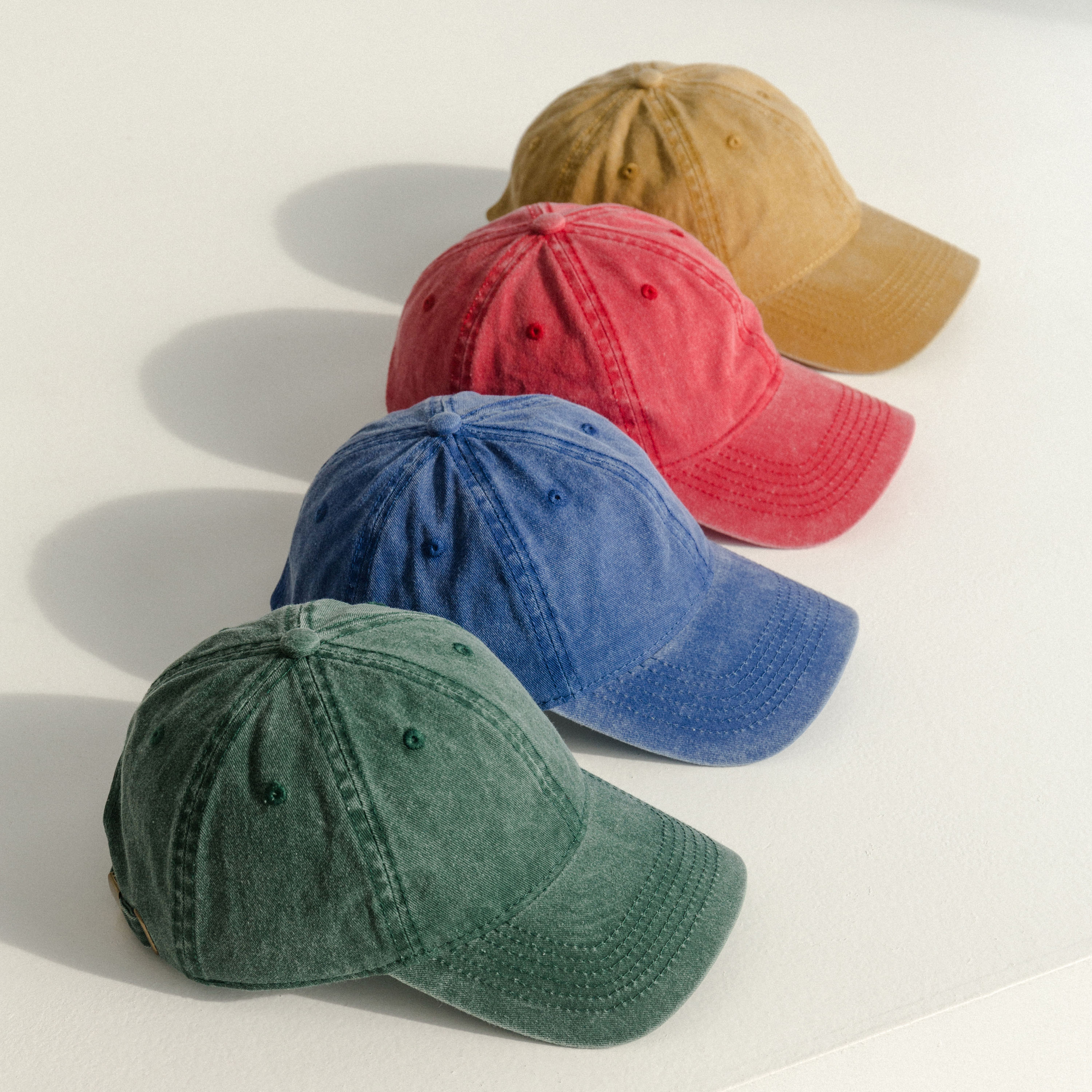 Classic Pigment Dyed Cap made of washed cotton twill, featuring an adjustable metal cam buckle closure and a low-profile design.