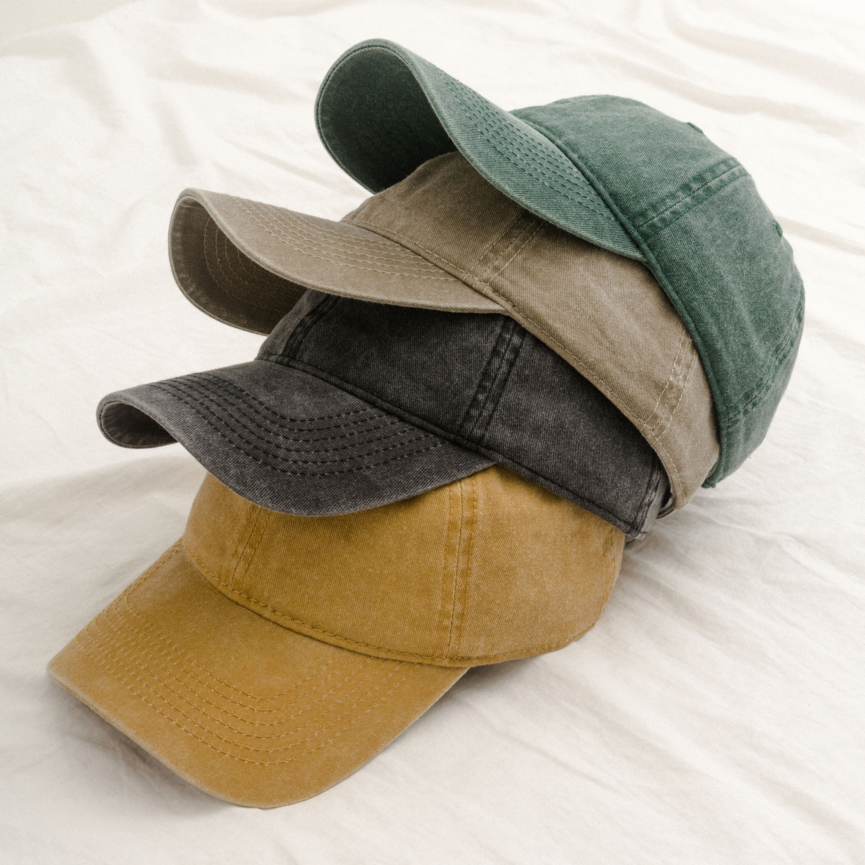 Classic Pigment Dyed Cap made of washed cotton twill, featuring an adjustable metal cam buckle closure and a low-profile design.