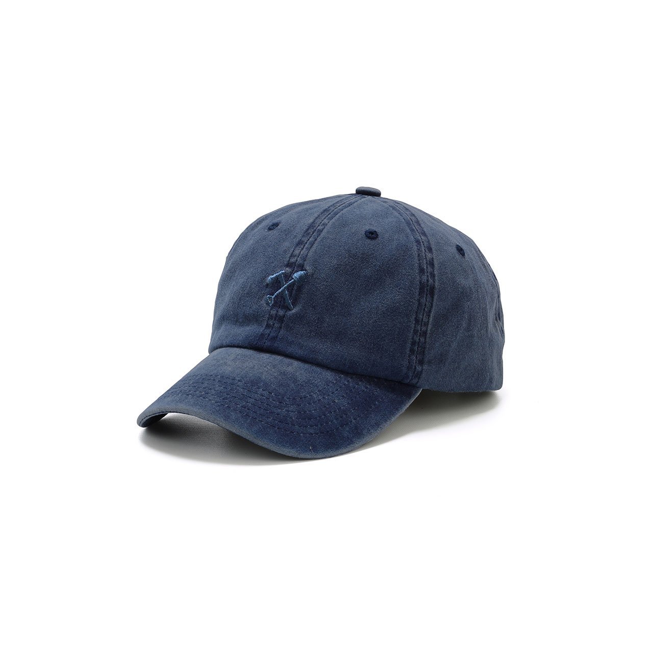 Cody Dad Hat featuring a curved brim and embroidered shovel and ax logo, showcasing a unique snow washed finish.