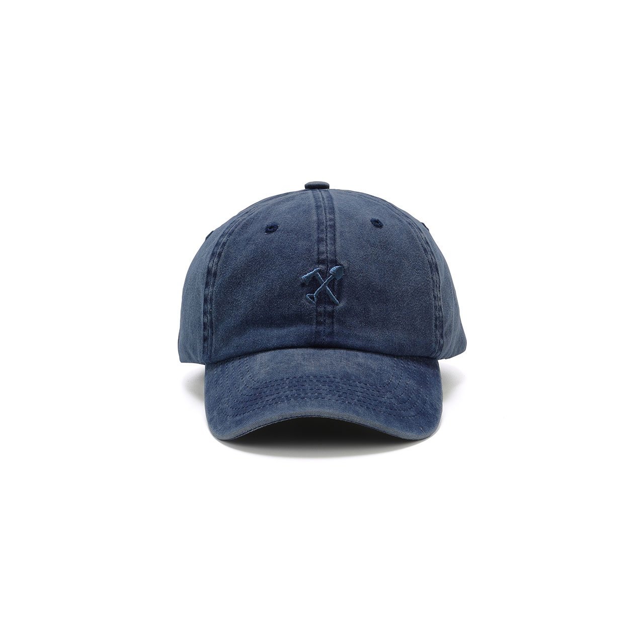 Cody Dad Hat featuring a curved brim and embroidered shovel and ax logo, showcasing a unique snow washed finish.