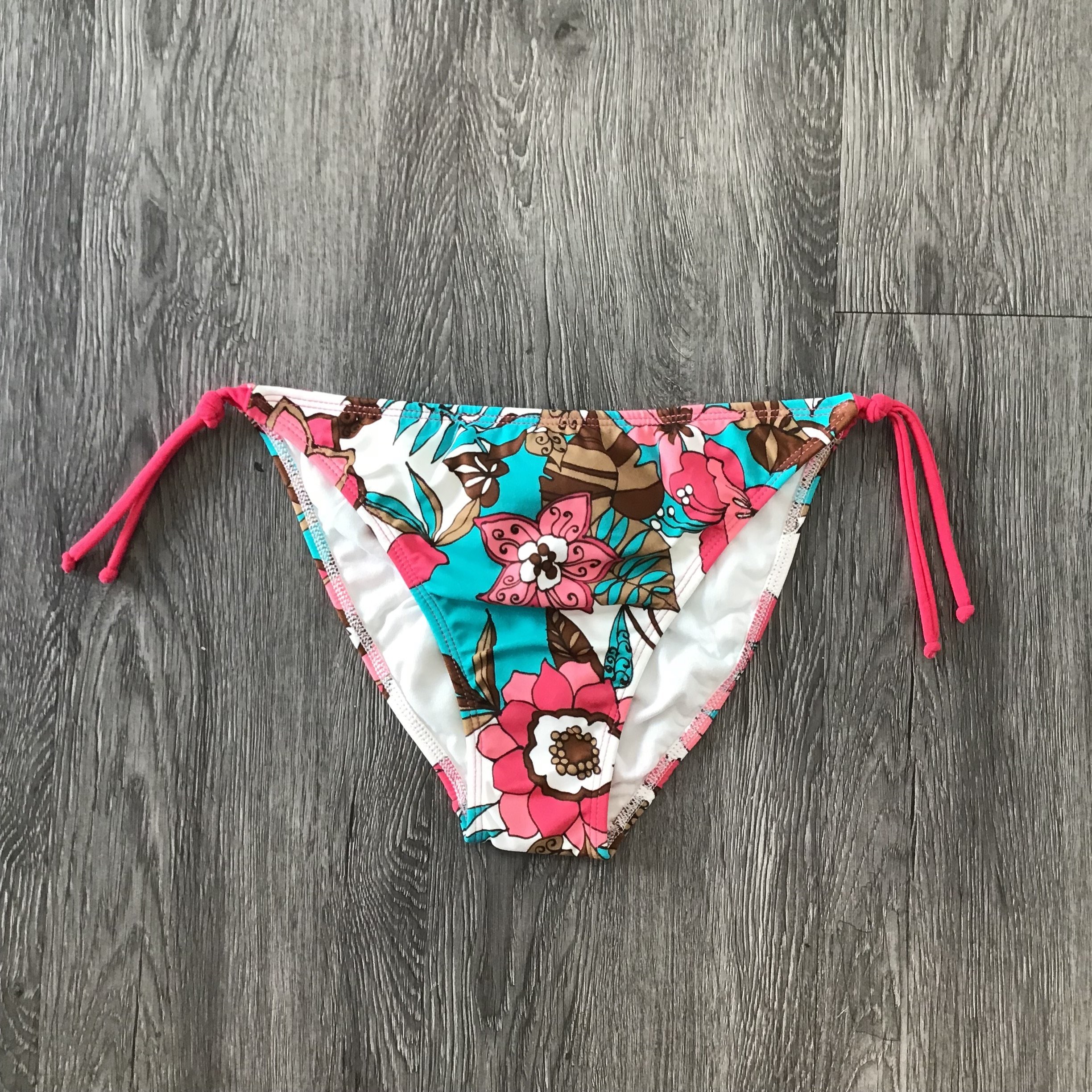 EVA Fuchsia and Turquoise Bikini Bottom displayed on a white background, showcasing its vibrant colors and stylish design.