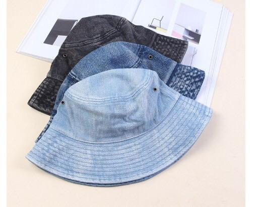 A stylish faded denim bucket hat, showcasing a vintage design perfect for trendsetters.