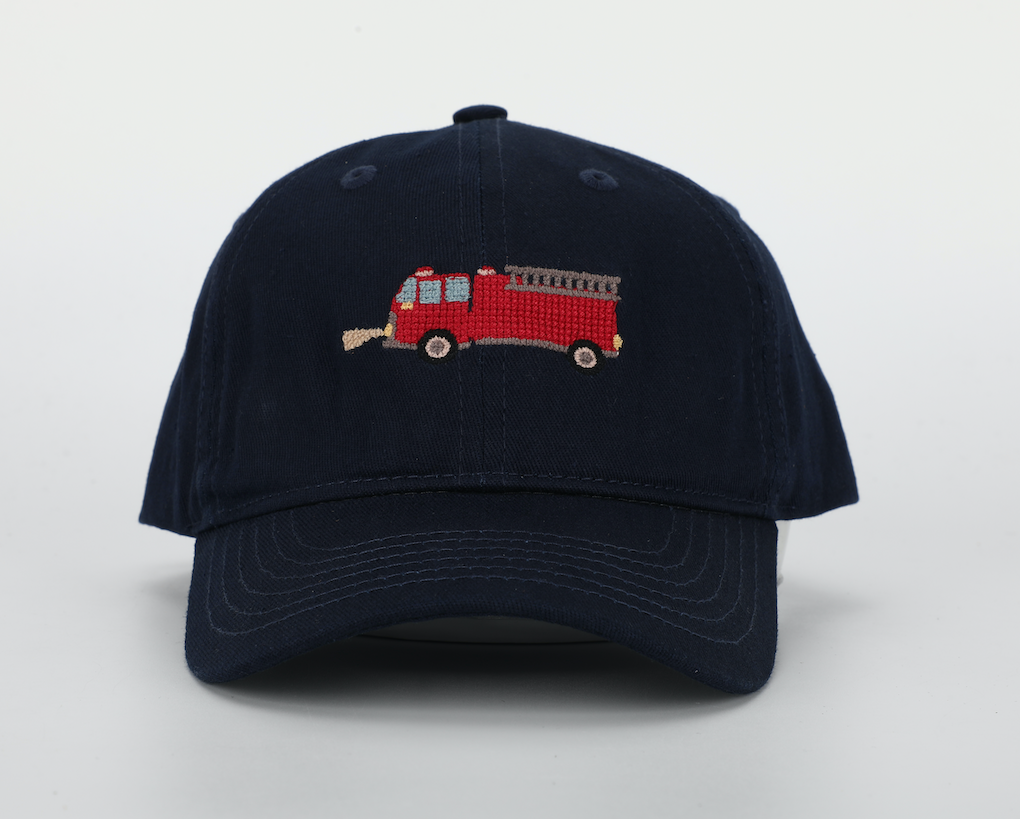 A vibrant Firetruck Hat for children, featuring a cognac leather adjustable strap and brass embossed buckle, perfect for ages 1-10.