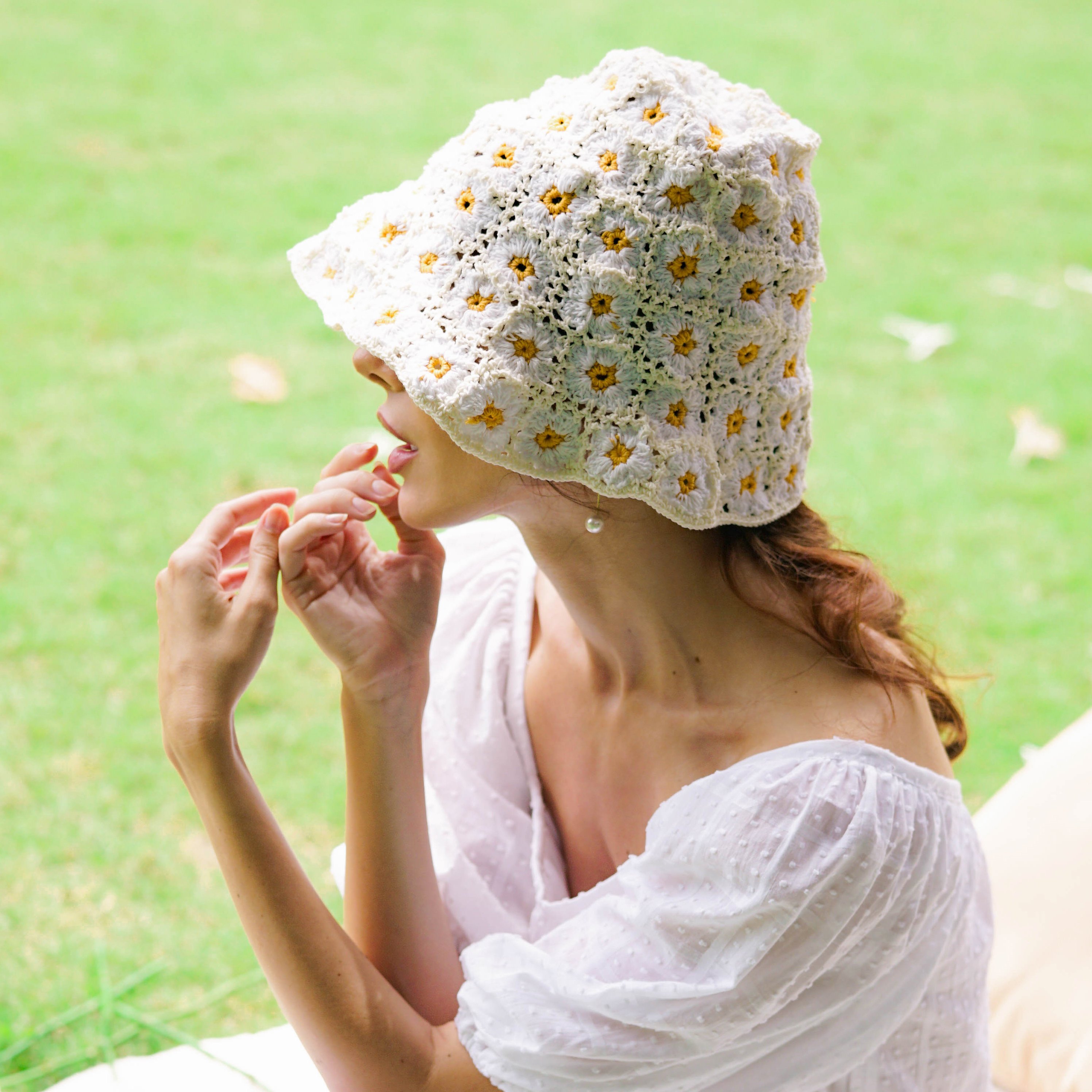 FLORA Crochet Hat in Off White, featuring a soft, shapeable design inspired by Calla Lily flowers, perfect for outdoor activities.