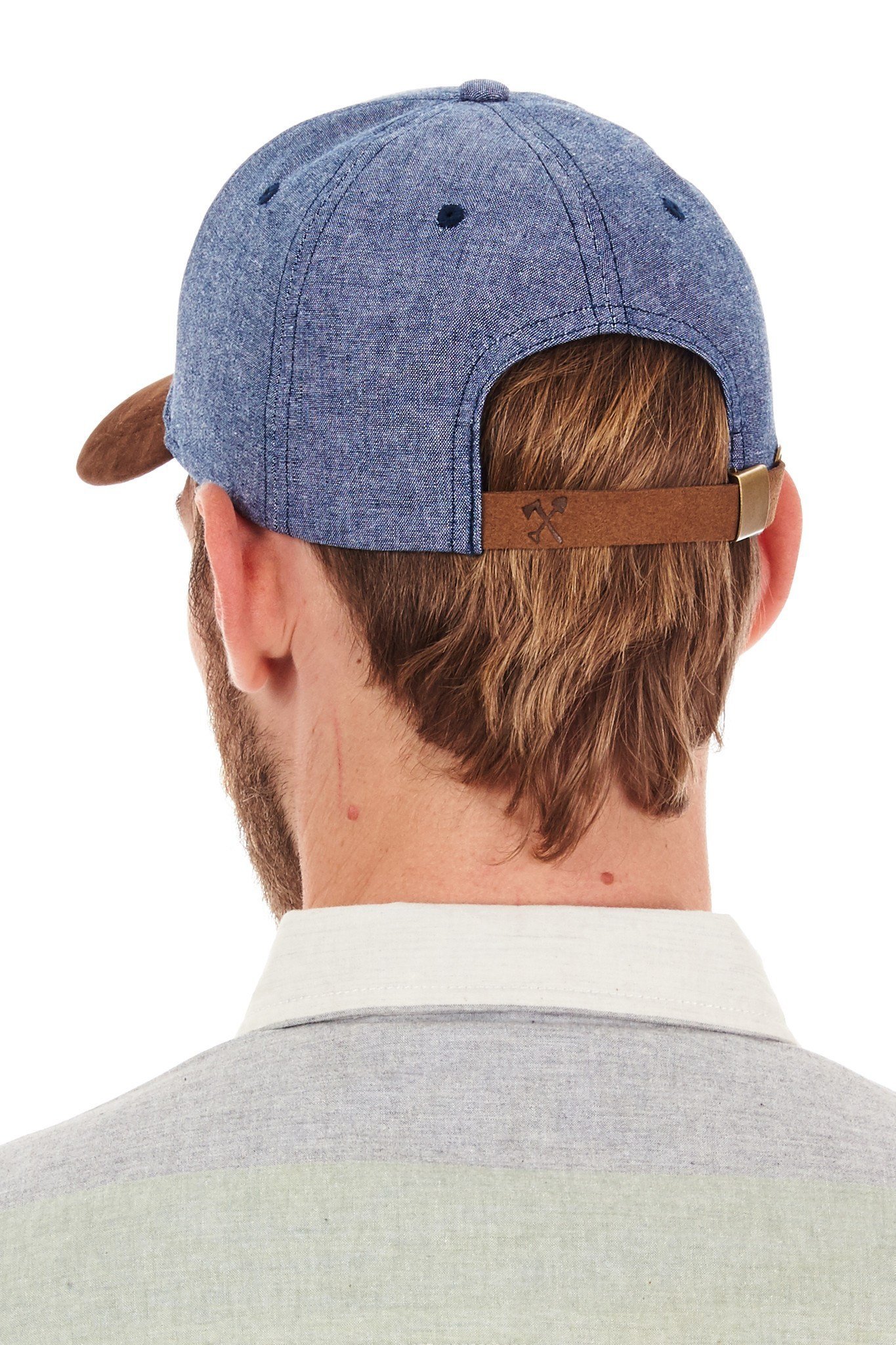 Man wearing blue baseball cap.