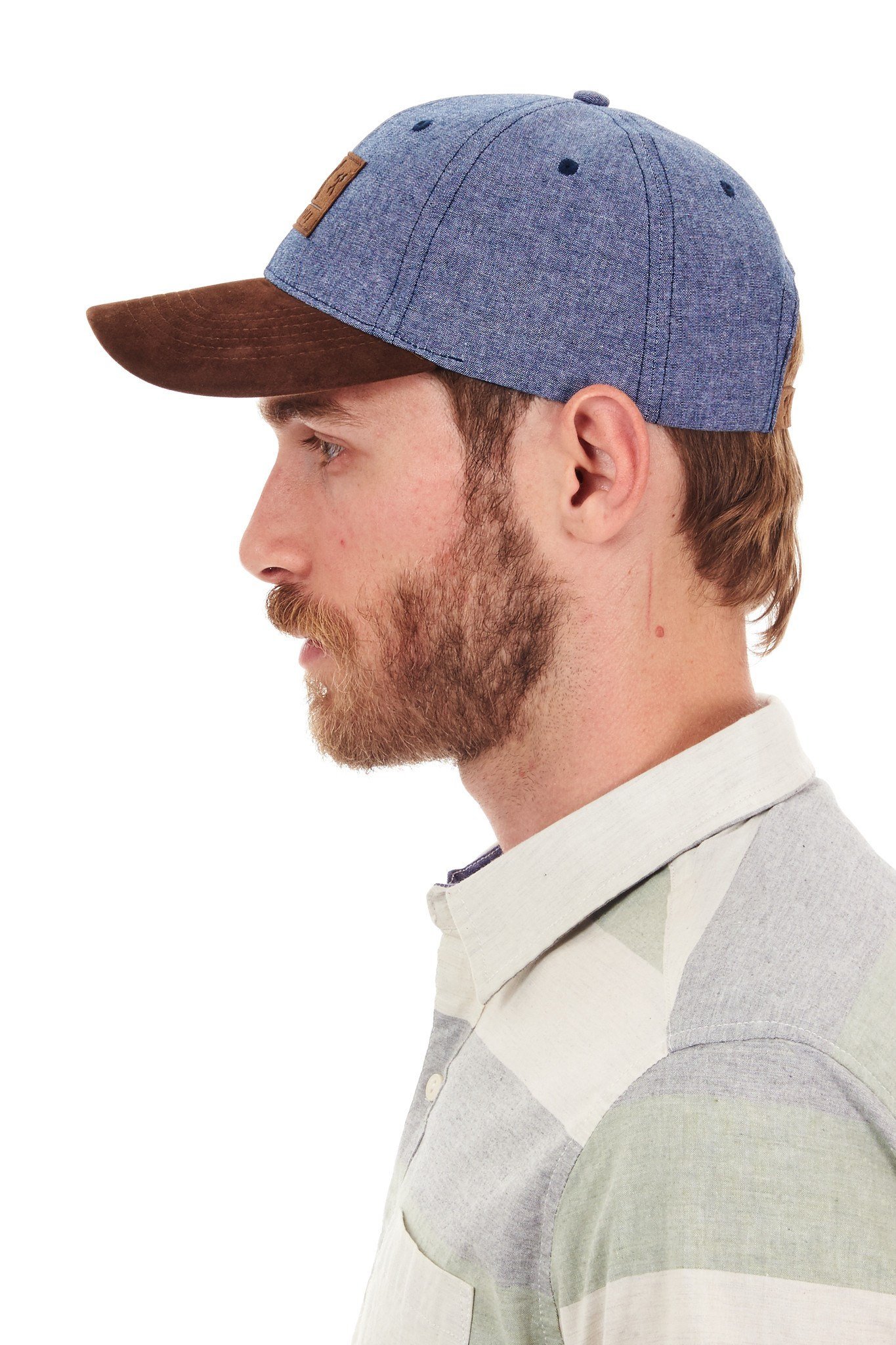 Man wearing blue and brown cap.