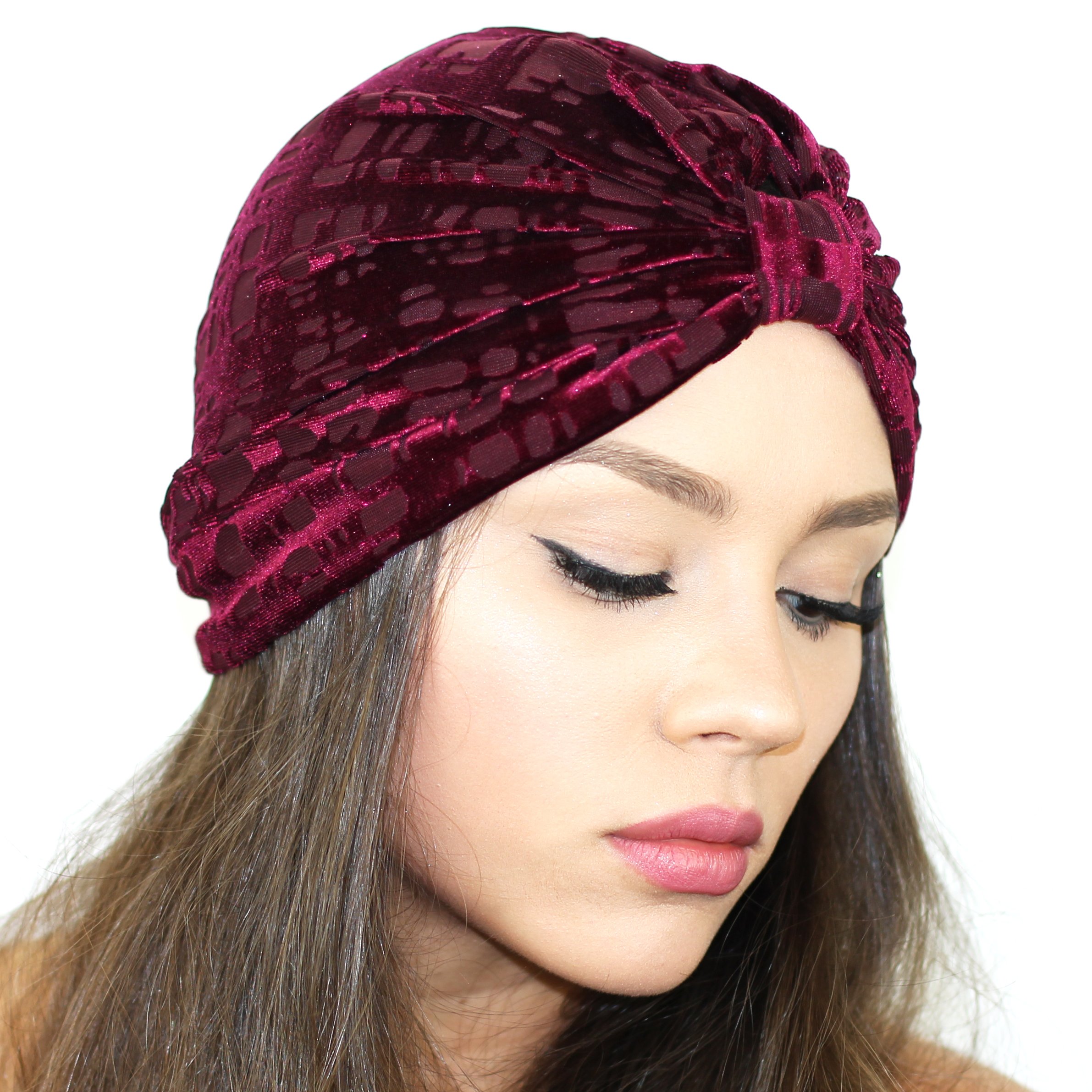 A stylish Gridiron Burnout Turban made of lightweight stretch velvet, available in Berry, Navy, and Black colors, showcasing its plush texture and cinched back design.