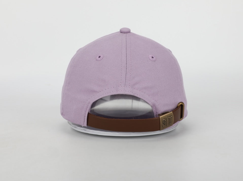 A stylish Gymnastic hat for children, featuring a cognac leather adjustable strap, brass embossed buckle, and unique needlepoint embroidery designs.