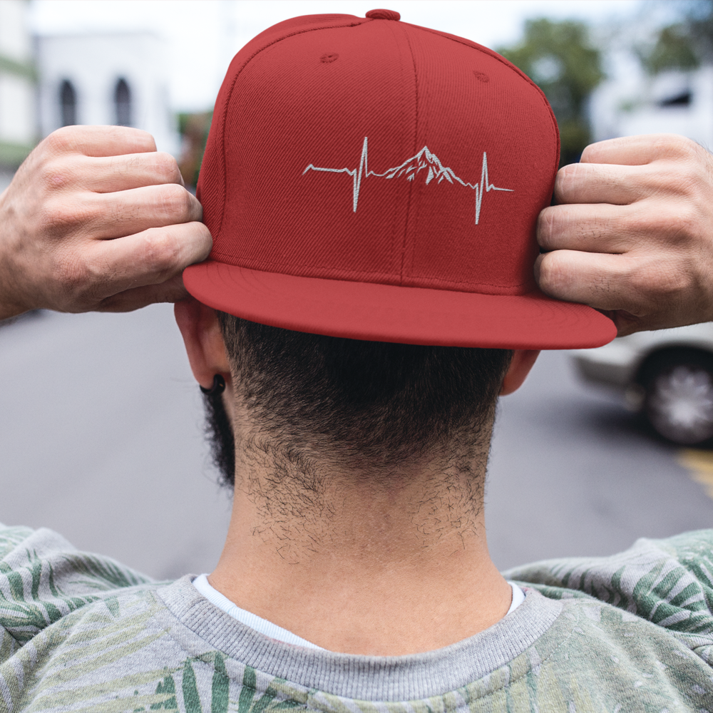 Heartbeat V1 Embroidered Flat Bill Cap showcasing its structured design and green under visor.