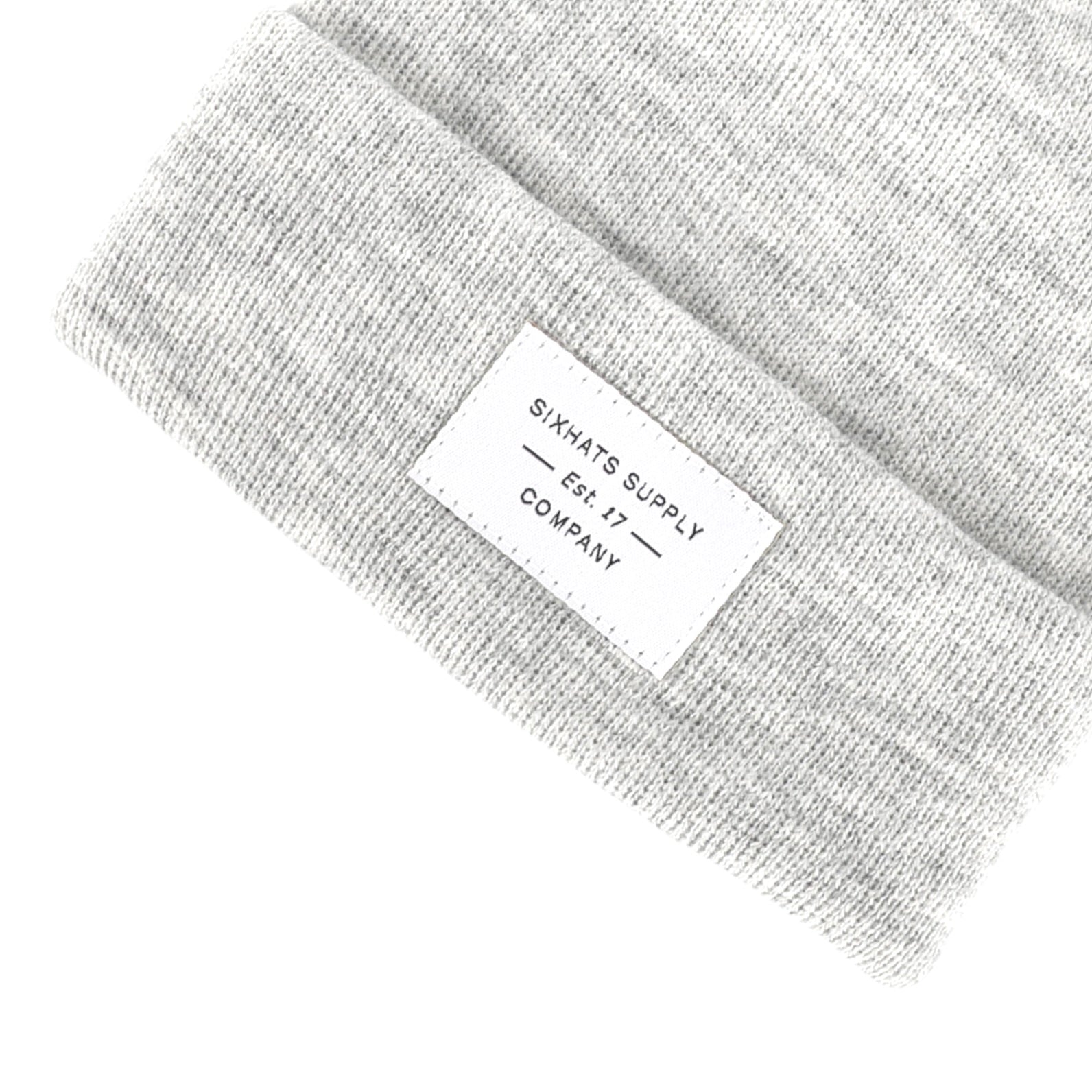 Heather Grey Folding Beanie displayed on a neutral background, showcasing its soft texture and stylish design.