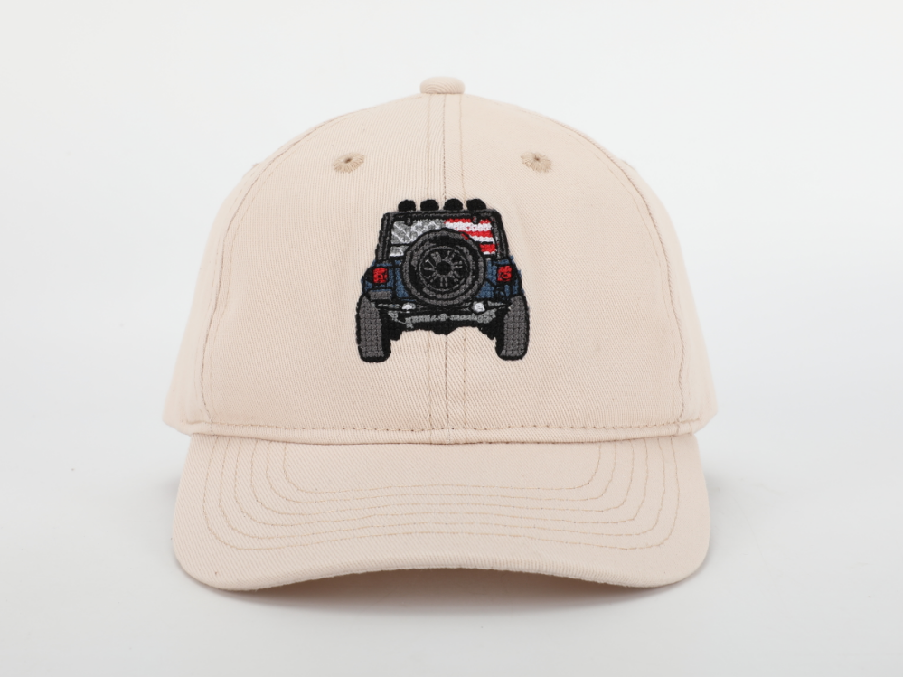 A stylish Jeep Hat for children featuring a cognac leather adjustable strap and needlepoint embroidery designs.