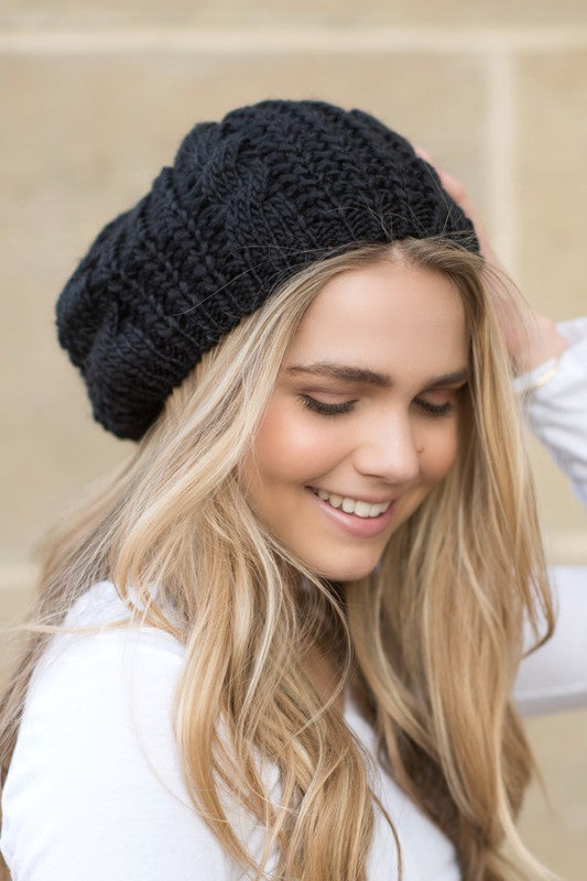 A cozy Knit Slouchy Beret made from super soft acrylic, featuring a stylish knitted design suitable for teens and adults.