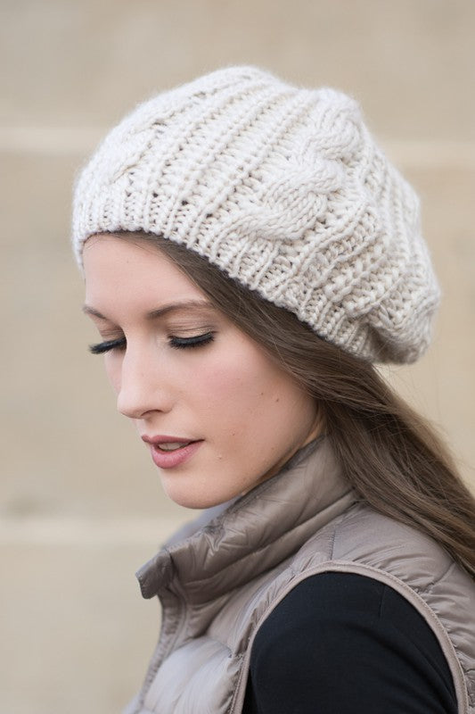 A cozy Knit Slouchy Beret made from super soft acrylic, featuring a stylish knitted design suitable for teens and adults.