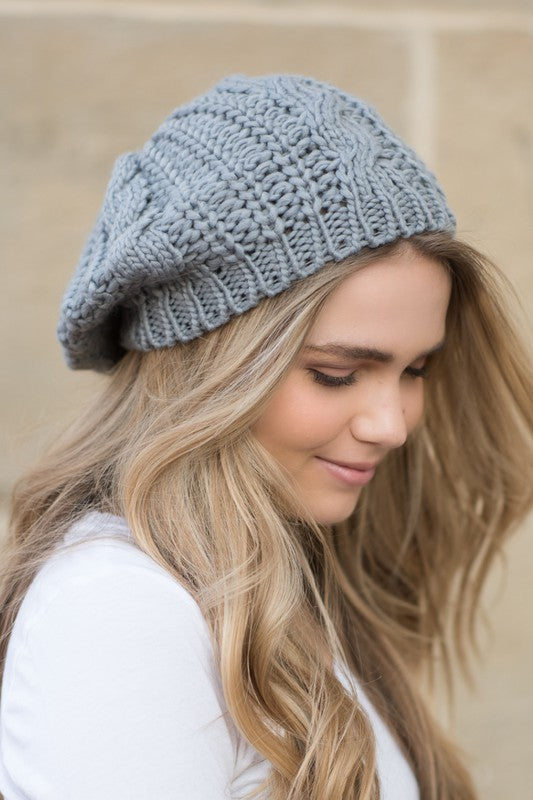 A cozy Knit Slouchy Beret made from super soft acrylic, featuring a stylish knitted design suitable for teens and adults.